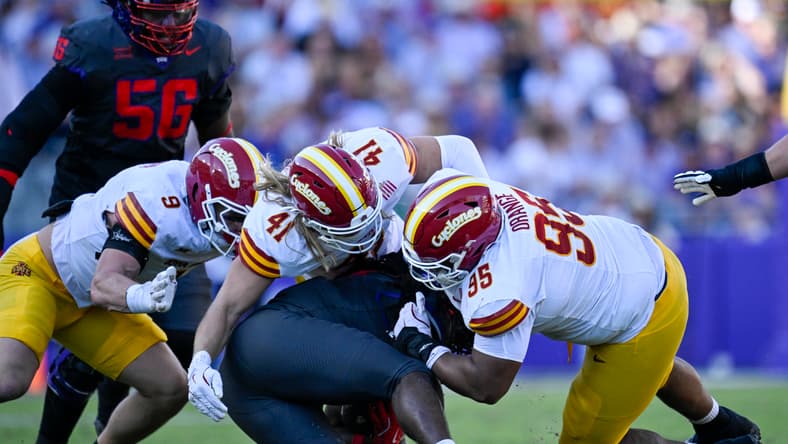 TCU running back Kevorian Barnes is tackled by multiple Iowa State defenders during a game at Amon G. Carter Stadium in Fort Worth.