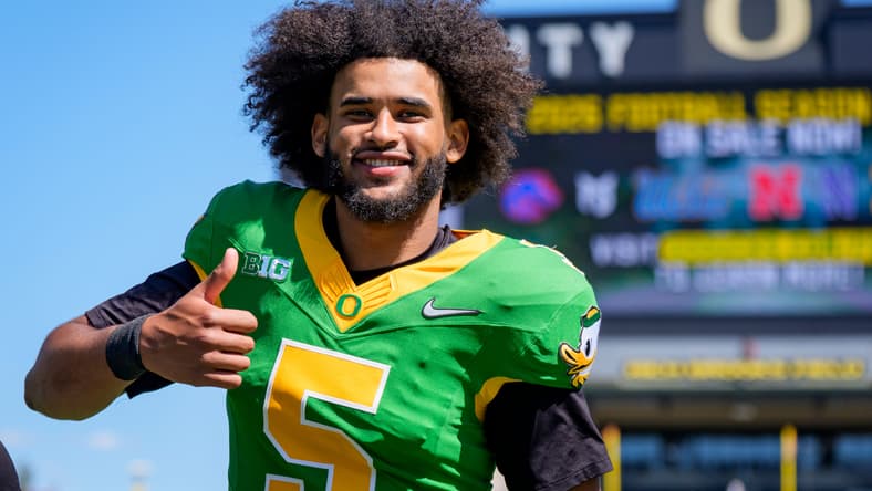 Dante Moore walks off the field during Oregon’s annual spring game at Autzen Stadium. Vikings quarterback
