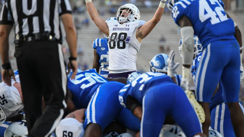 Marshall Lang celebrates a touchdown during Northwestern's game against Duke at Wallace Wade Stadium.