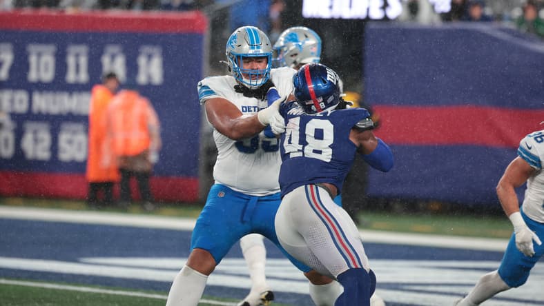 Benton Whitley engages a block against the Lions in preseason.