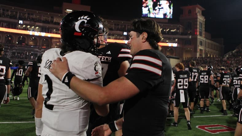 Brendan Sorsby and Behren Morton meet after a game at Texas Tech in Lubbock.