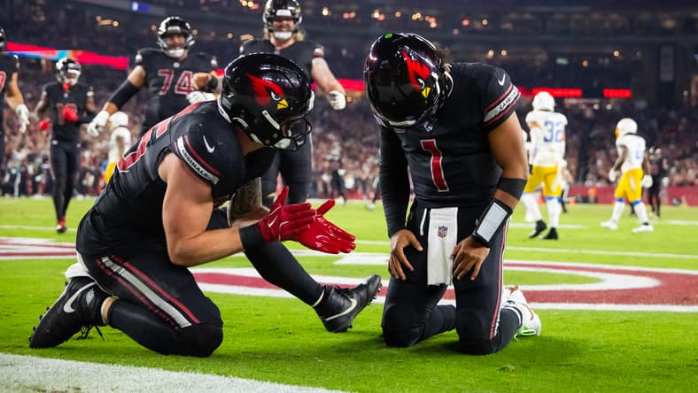 Kyler Murray and Trey McBride celebrate a TD in 2024