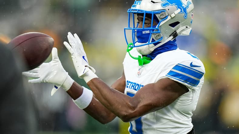 Detroit Lions cornerback Terrion Arnold warms up before a game against the Green Bay Packers.