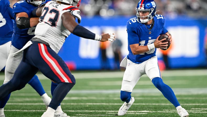 Jahvaree Ritzie chases Tommy DeVito during a preseason game between the Patriots and Giants at MetLife Stadium.