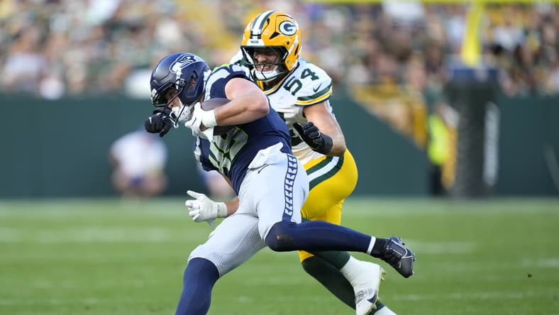 Marshall Lang is tackled by Kristian Welch during a preseason game between the Seahawks and Packers at Lambeau Field.
