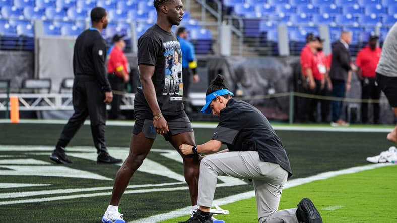 Detroit Lions cornerback Terrion Arnold is checked during warmups before facing the Baltimore Ravens.