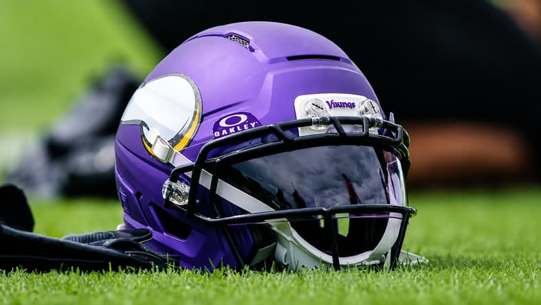 A Minnesota Vikings helmet sits on the practice field during OTA activities in Eagan.