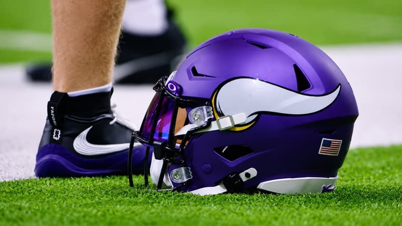 Minnesota Vikings helmet rests on the turf during minicamp.