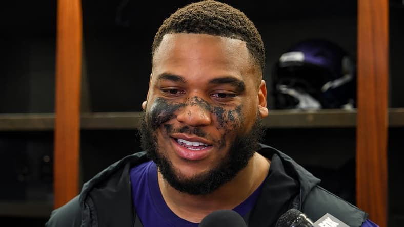 Christian Darrisaw speaks with reporters after a Vikings win over the Bengals.