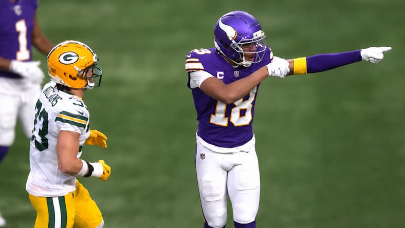Justin Jefferson points during Vikings-Packers Week 18 action.