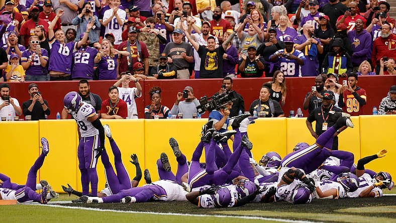 Vikings players celebrate Harrison Smith’s interception vs. Commanders.