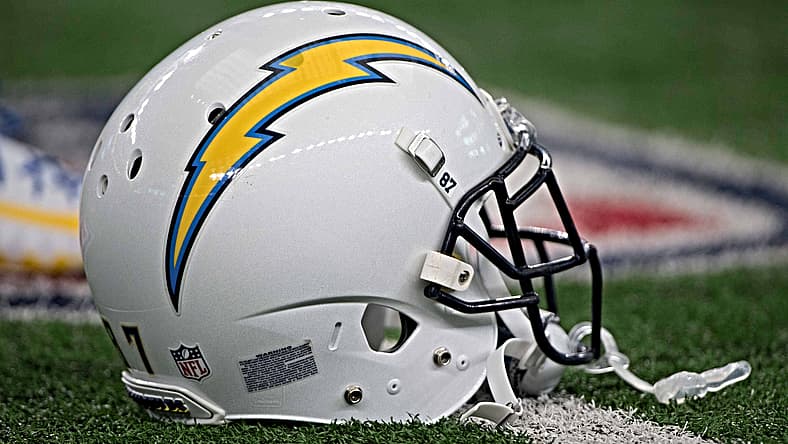 A Los Angeles Chargers helmet sits on the sideline before the team’s Thanksgiving Day win over the Cowboys at AT&T Stadium.