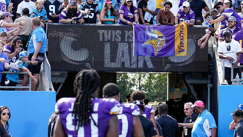 Vikings fans celebrate with custom signs after road win vs. Panthers.