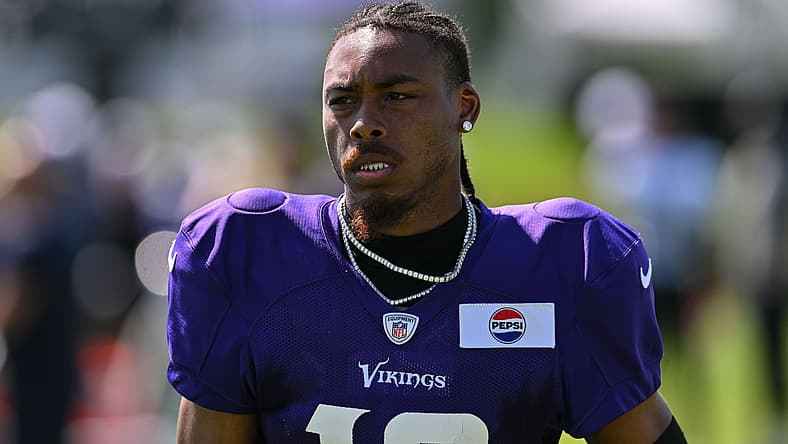 Justin Jefferson observes practice during Vikings training camp in Eagan.