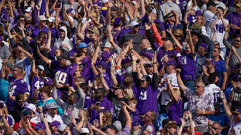 Vikings fans celebrate a Jordan Addison touchdown during a road game at Nissan Stadium in Nashville.