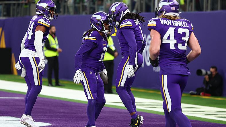 Stephon Gilmore celebrates an interception with Shaquill Griffin during a Vikings game in London against the Jets.
