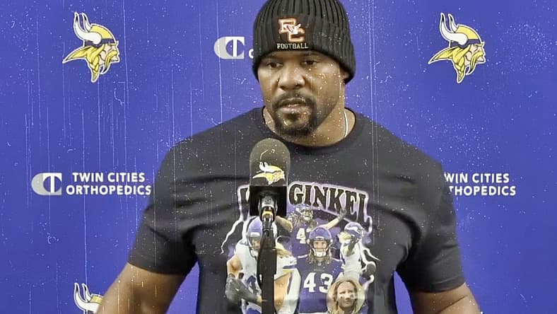 Vikings defensive coordinator Brian Flores speaks to reporters during a midweek media session.