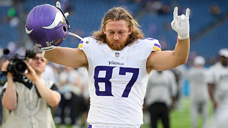 T.J. Hockenson waves to fans during Vikings game at Nissan Stadium.