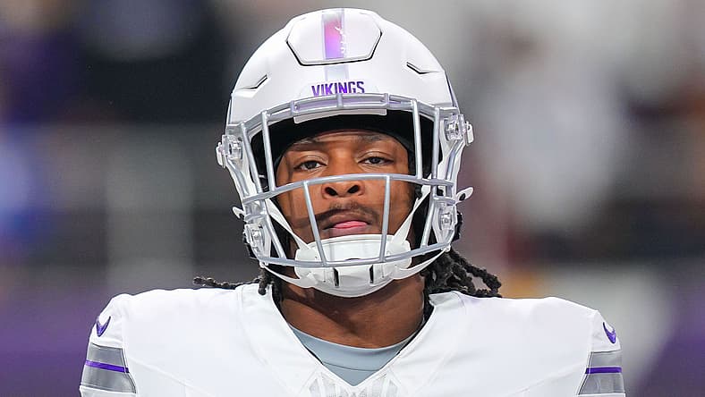 Ty Chandler warms up before a game against the Bears at U.S. Bank Stadium.