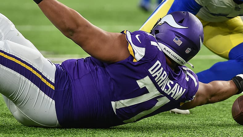 Christian Darrisaw chases and recovers a fumble during the Vikings' game against the Los Angeles Rams at U.S. Bank Stadium.