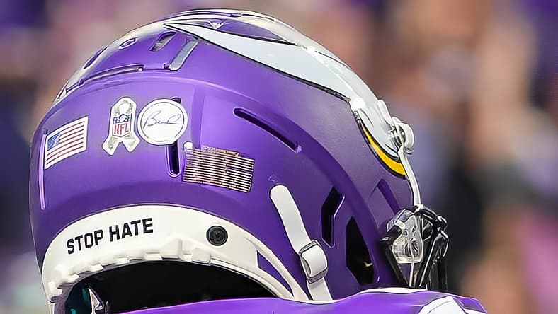 T.J. Hockenson and Jalen Nailor celebrating a Vikings touchdown at U.S. Bank Stadium.