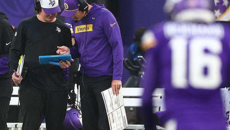 Kevin O’Connell reviews plays during the fourth quarter of the Vikings’ game against the Jets in London.