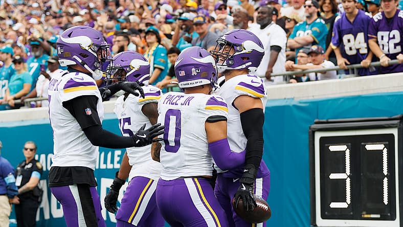 Vikings defenders celebrate a fumble recovery during the game against the Jaguars at EverBank Stadium.