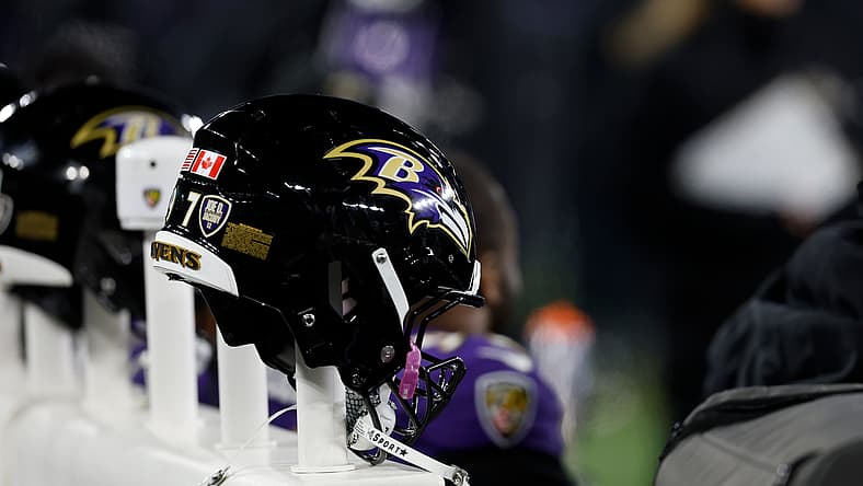 Baltimore Ravens helmets on a heated bench during a playoff game