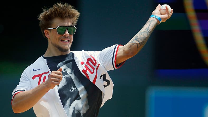 Koi Perich, a Golden Gopher, throws out a pitch a Twins game