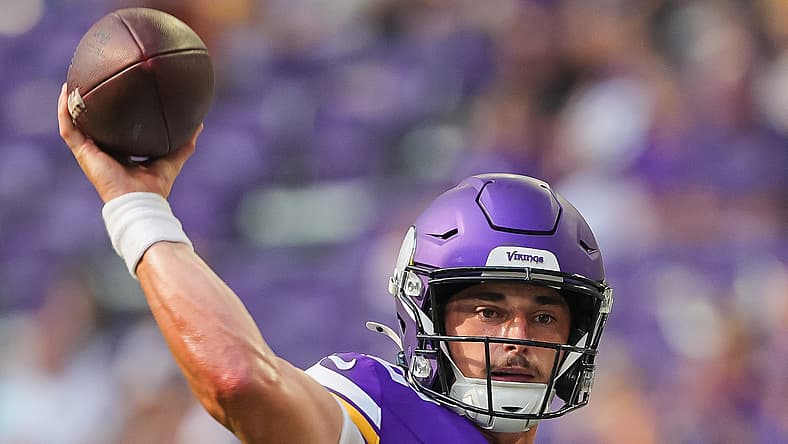 Max Brosmer throws a touchdown pass for the Vikings against the Texans.