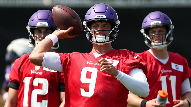 J.J. McCarthy runs drills at Vikings training camp in Eagan.