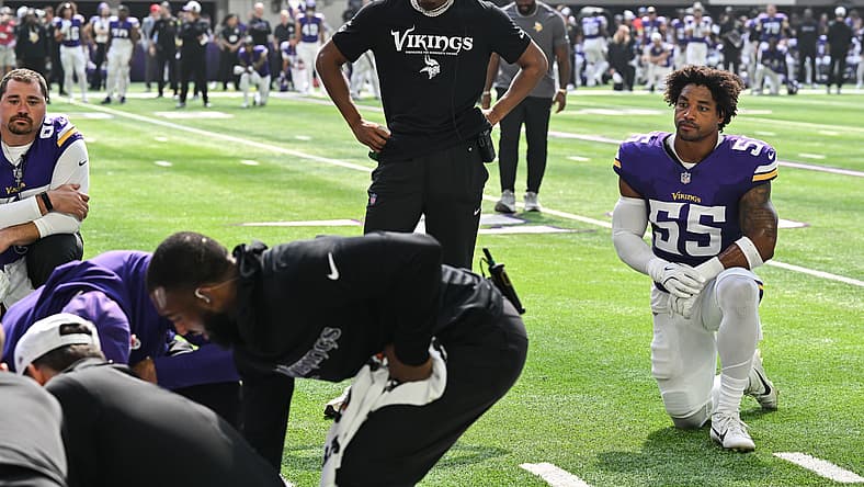 Justin Jefferson and Eric Wilson watch trainers tend to injured Rondale Moore during Vikings vs. Texans game.