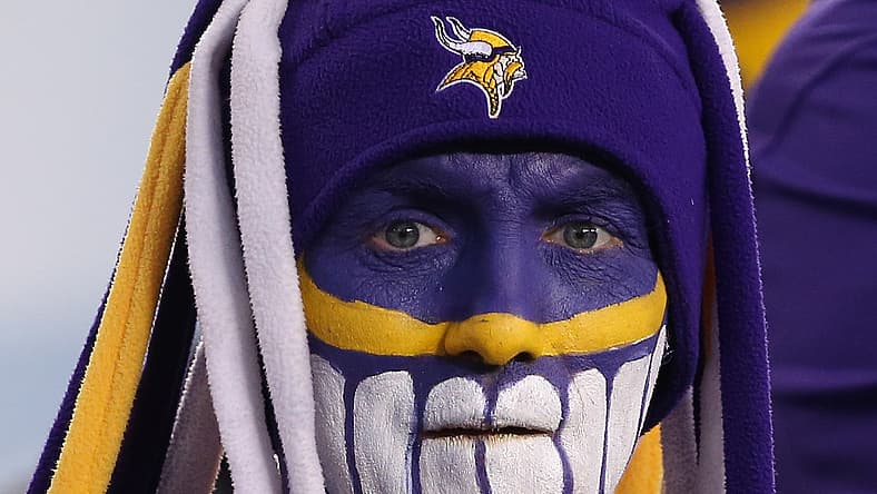 Minnesota Vikings fan in purple gear stands in the crowd at Lincoln Financial Field before the NFC Championship Game against the Eagles.