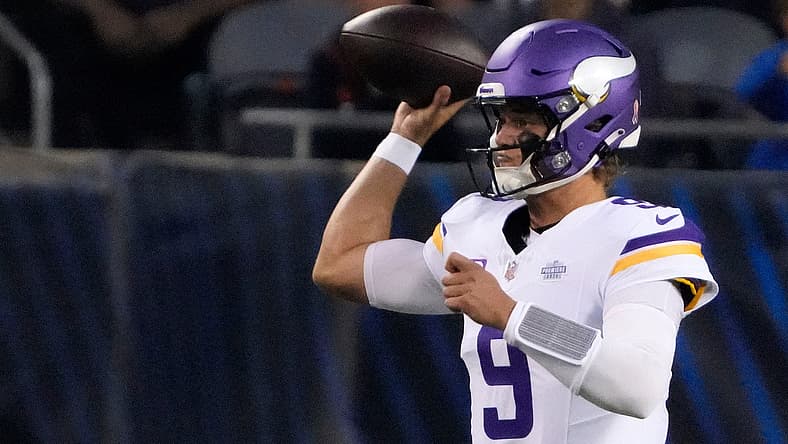 J.J. McCarthy drops back to pass during the Vikings' game against the Chicago Bears at Soldier Field.