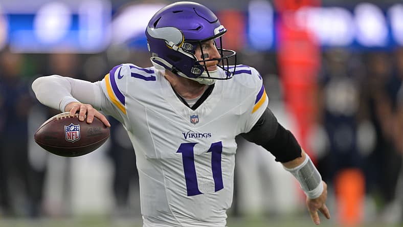 Carson Wentz drops back to pass during the Vikings’ first-half matchup against the Chargers at SoFi Stadium.