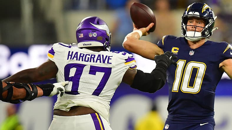Oct 23, 2025; Inglewood, California, USA; Minnesota Vikings defensive tackle Javon Hargrave (97) collapses the pocket while pursuing Los Angeles Chargers quarterback Justin Herbert (10) during first-half action at SoFi Stadium. Hargrave’s interior pass rush forced Herbert off his spot as the Vikings’ defensive front attempted to disrupt the Chargers’ rhythm through consistent pressure. Mandatory Credit: Gary A. Vasquez-Imagn Images