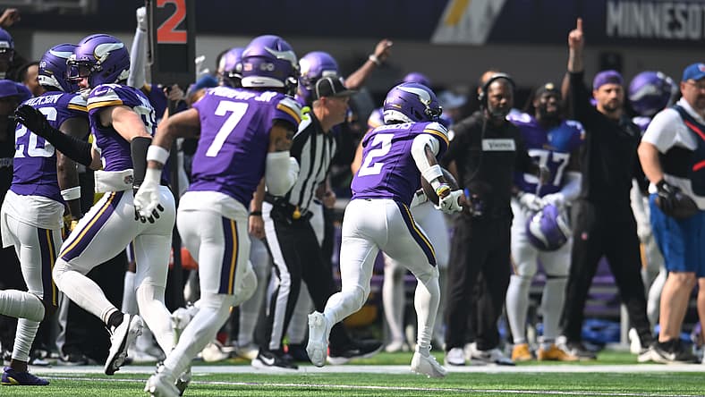Minnesota Vikings cornerback Isaiah Rodgers runs with the ball after intercepting a pass and scoring a touchdown against the Cincinnati Bengals at U.S. Bank Stadium..