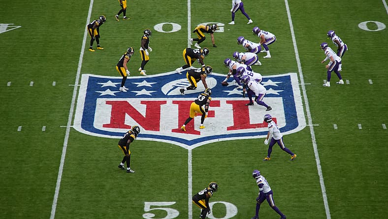 Carson Wentz taking a snap at midfield during a Vikings game at Croke Park in Dublin.