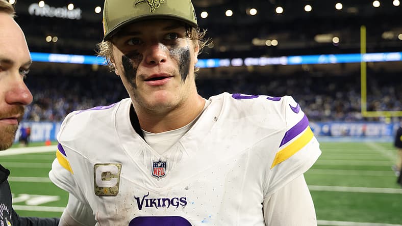 J.J. McCarthy walks off the field after the Vikings' divisional game against the Detroit Lions at Ford Field.