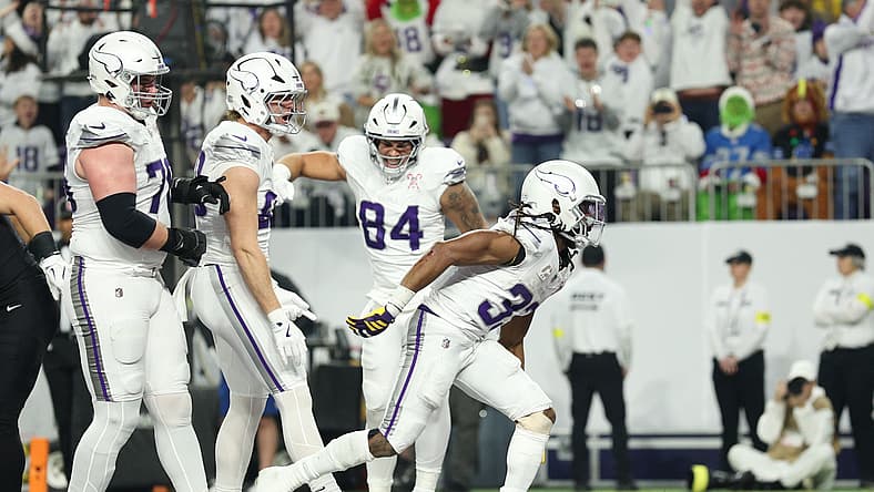 Aaron Jones Sr. celebrates after scoring a touchdown against the Lions.