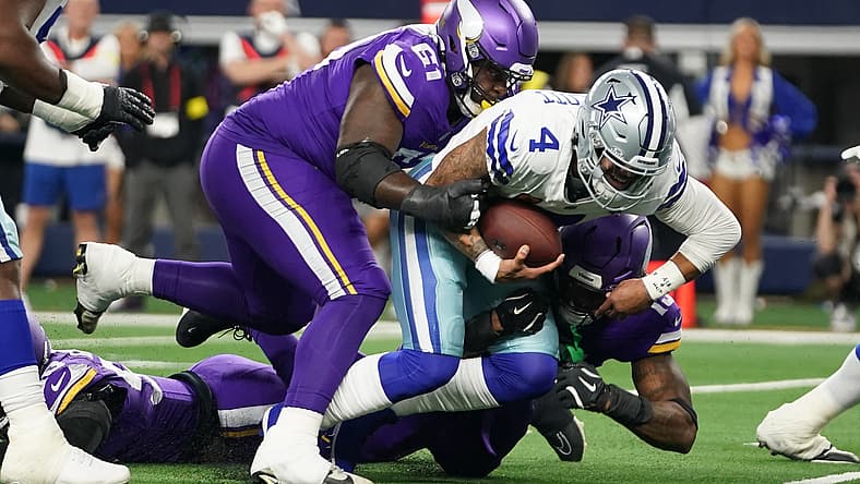 Jalen Redmond tackles Dak Prescott during a Vikings vs. Cowboys game at AT&T Stadium. NFC North defensive line rankings