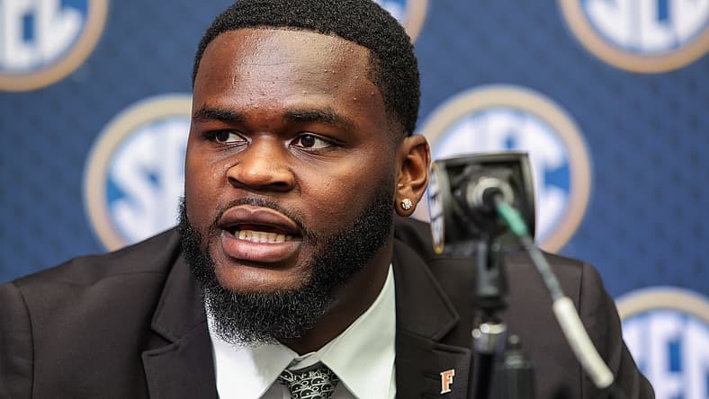 Caleb Banks speaks with reporters during SEC Media Days in Atlanta.