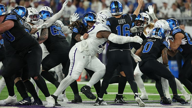 Javon Hargrave tackles Jared Goff during a Vikings-Lions game at U.S. Bank Stadium.
