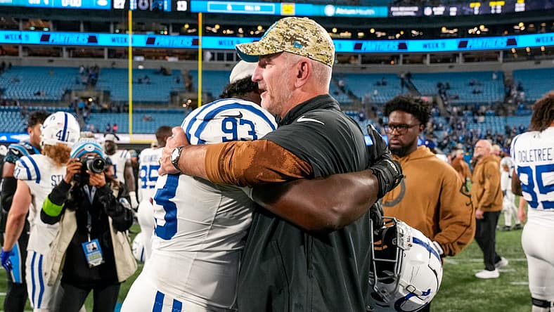 Colts DT Eric Jkhnson hug Frank Reich