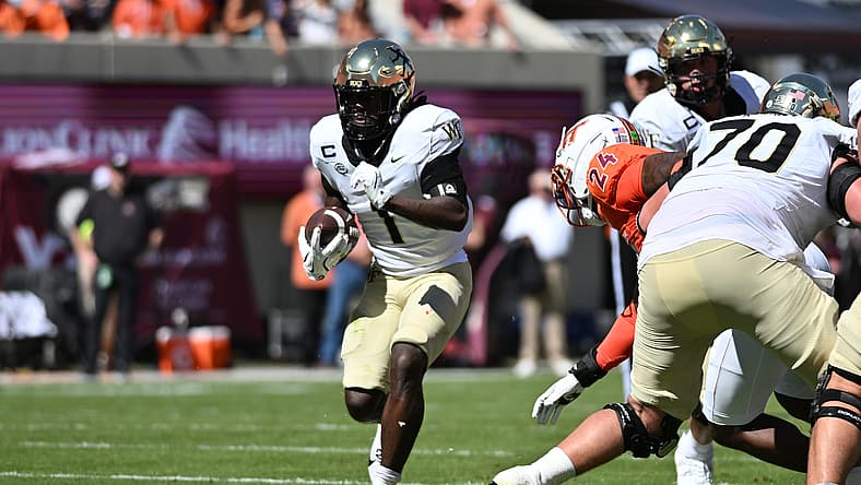 Demond Claiborne runs the football against Virginia Tech. Vikings training camp