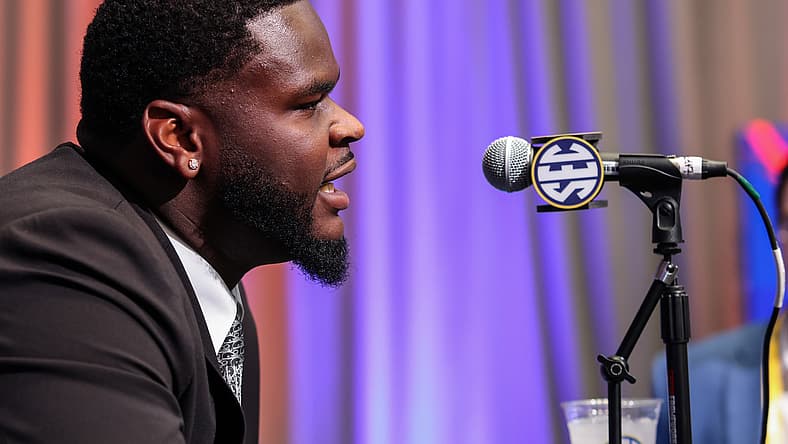 Caleb Banks answers questions from reporters during SEC Media Days in Atlanta.