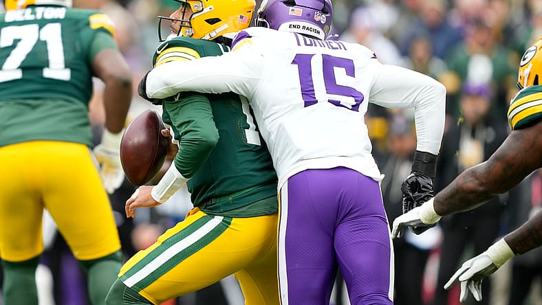 Dallas Turner sacks Jordan Love during a Vikings-Packers game at Lambeau Field. Vikings red flags 2026