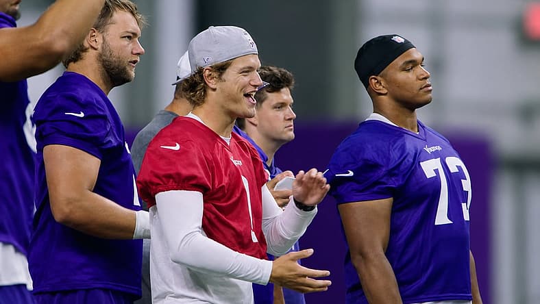 J.J. McCarthy chats with Ryan Van Demark and Walter Rouse during Day 3 of Vikings minicamp in Eagan, Minnesota.