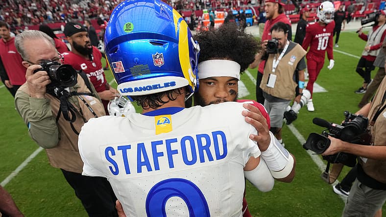 Rams QB Matthew Stafford and Cardinals QB Kyler Murray embrace after a game