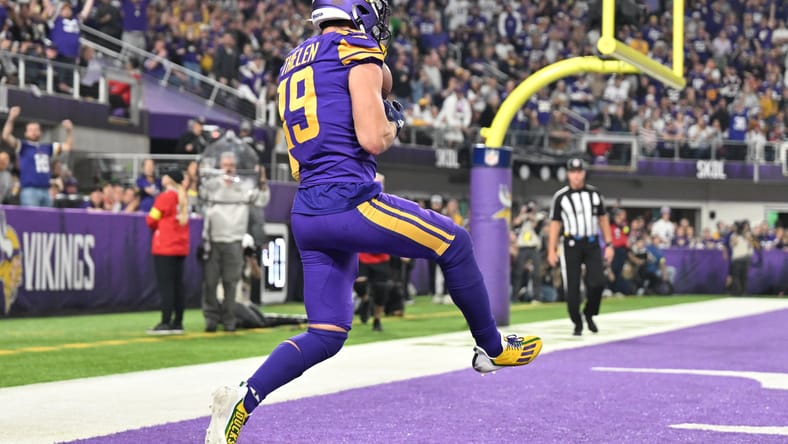Adam Thielen makes a touchdown catch against the Patriots at U.S. Bank Stadium.